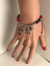 Red charm bracelets