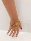 Gold charm bracelet w/loose rhinestone