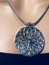 silver round pendant necklace with loose stones