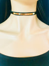 Black choker with gold hardware